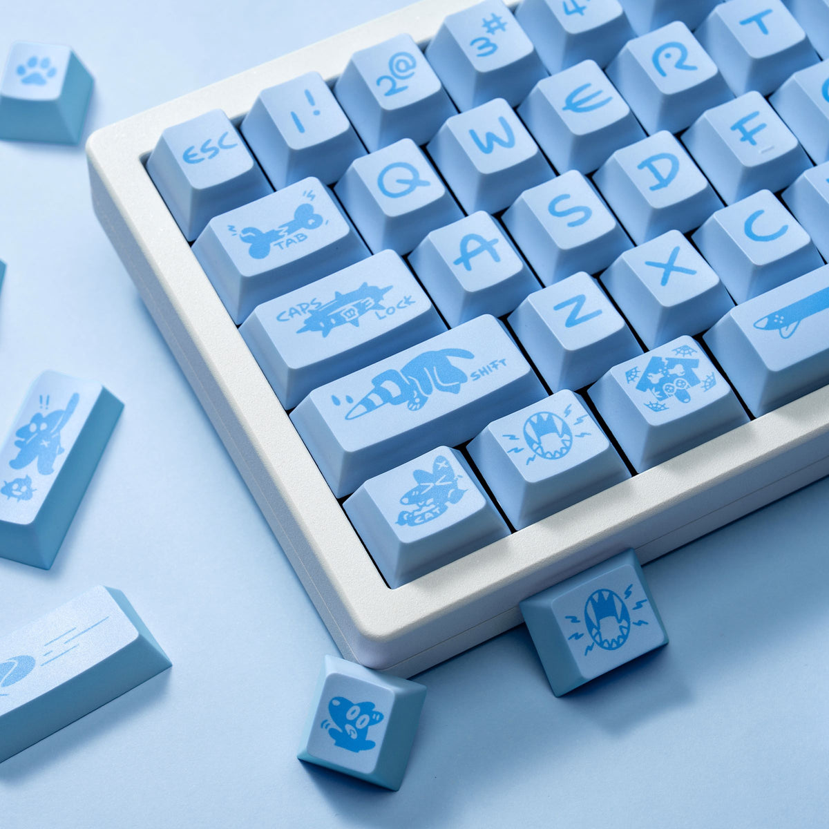 Close-up of blue and white Blue Puppy keycaps highlighting the textured PBT surface.