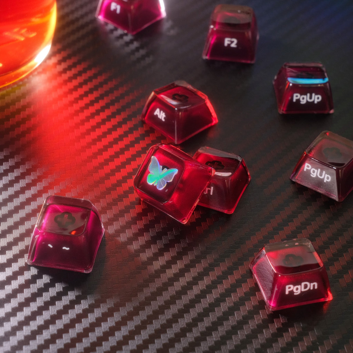 Loose Burgundy Wine Ice PC keycaps showing rounded MDA profiles and side-printed modifier legends.