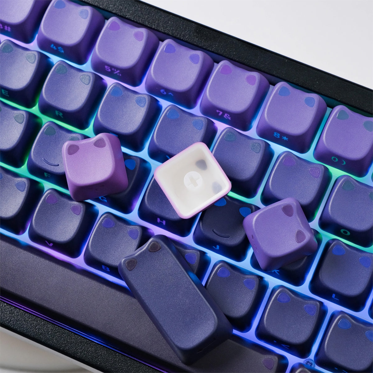Purple Cat Ear Keycaps with glowing ear accents