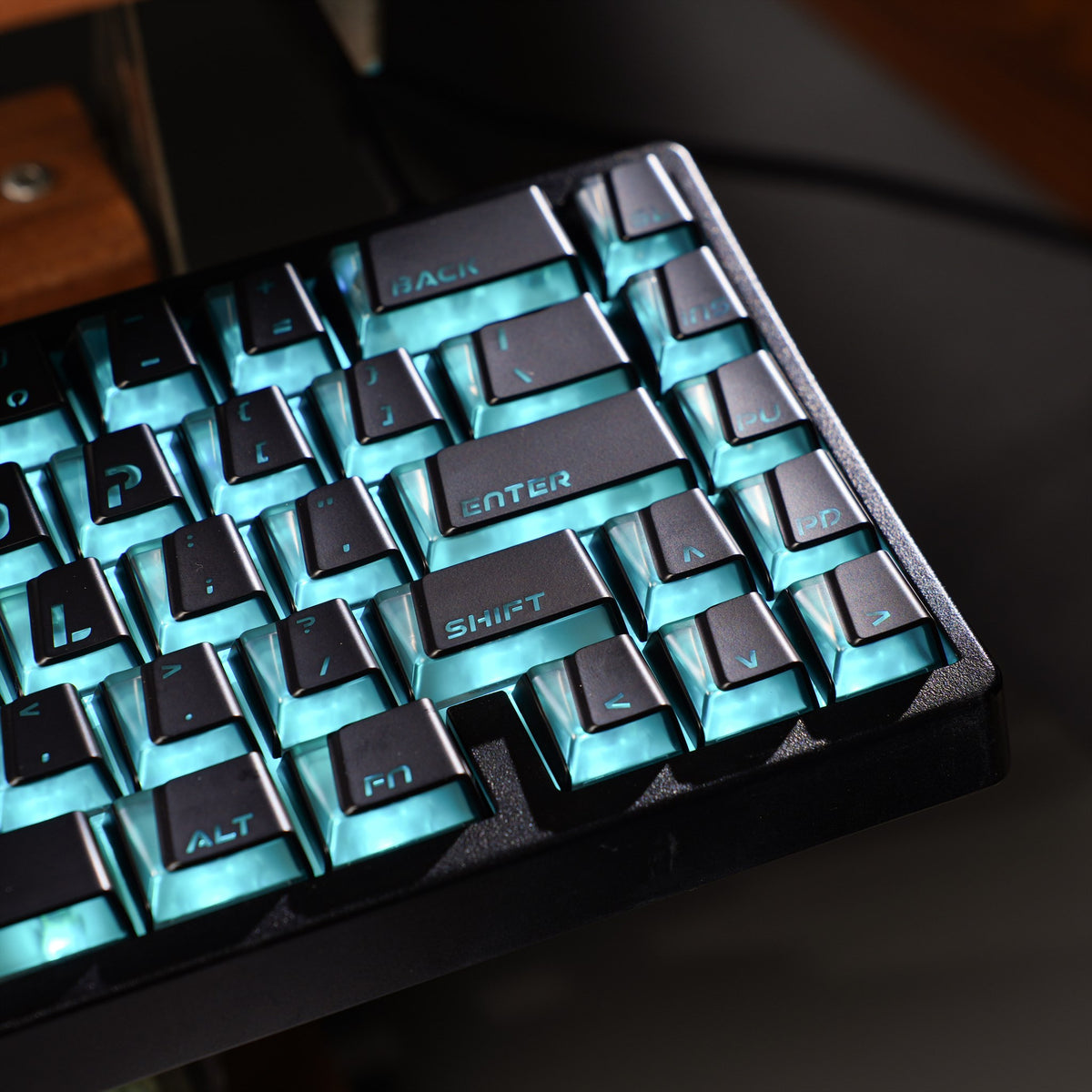 Black Prism keycaps showing geometric legends and transparent PC sidewalls.